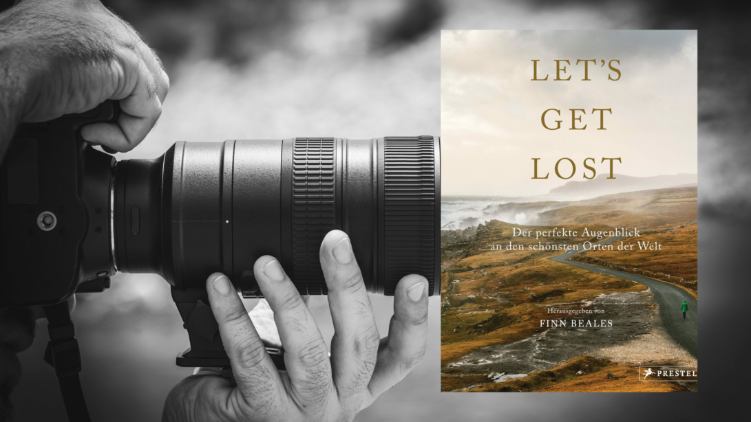 Buchcover "Lets get lost" von Finn Beales vor einer schwarz weißen Nahaufnahme einer gehaltenen Kamera
